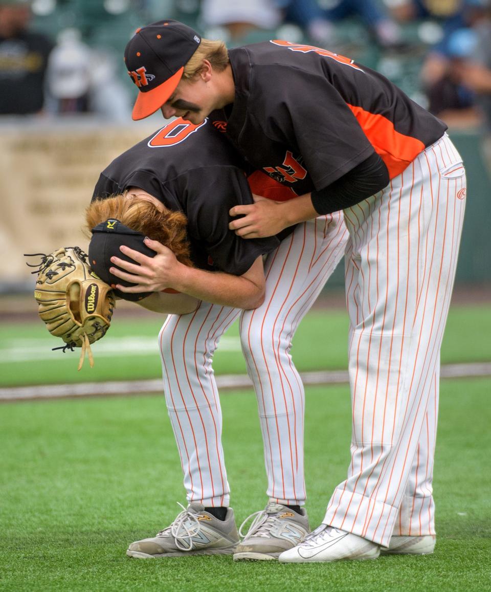 Washington shortstop Jake Stewart comforts senior pitcher Easton Harris after Harris struck out the final Crystal Lake South batter during the Class 3A state baseball third-place game Saturday, June 11, 2022 at Duly Health & Care Field in Joliet. The Panthers took third place with a 2-1 victory.