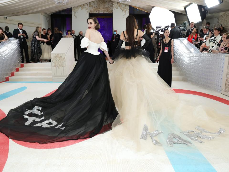 Lily Colins and Vera Wang at MEt Gala with KARL on their skirts