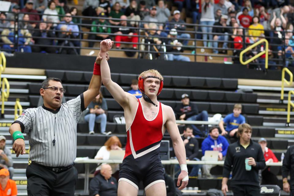 Wesley Smith of Plymouth celebrates after winning in the final at 145lbs during the IHSAA Wrestling Regionals Saturday, Feb. 4, 2023 at Penn High School.