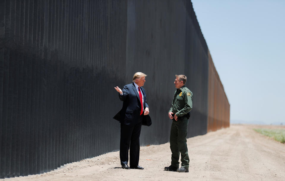 U.S. President Donald Trump talks with U.S. Border Patrol Chief Rodney Scott as he tours a section of the U.S.-Mexico border wall in San Luis, Arizona, U.S., June 23, 2020. REUTERS/Carlos Barria     TPX IMAGES OF THE DAY