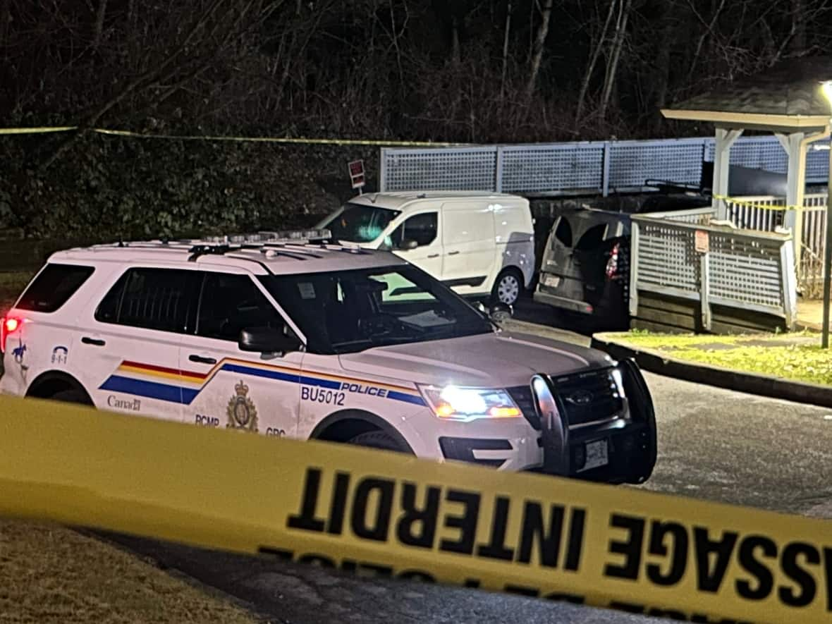 Police attention appeared to be focused on the underground parkade of the townhouse complex where the victim was found. (Mike Zimmer/CBC - image credit)