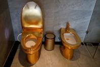 FILE PHOTO: Gold-plated toilets are seen at the newly inaugurated Dolce Hanoi Golden Lake hotel, after the government eased a nationwide lockdown following the global outbreak of the coronavirus disease (COVID-19), in Hanoi, Vietnam