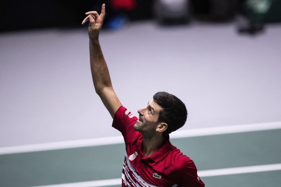 Serbia's Novak Djokovic celebrates after winning Japan's Yoshihito Nishioka during their Davis Cup tennis match in Madrid, Spain, Wednesday, Nov. 20, 2019. (AP Photo/Bernat Armangue)