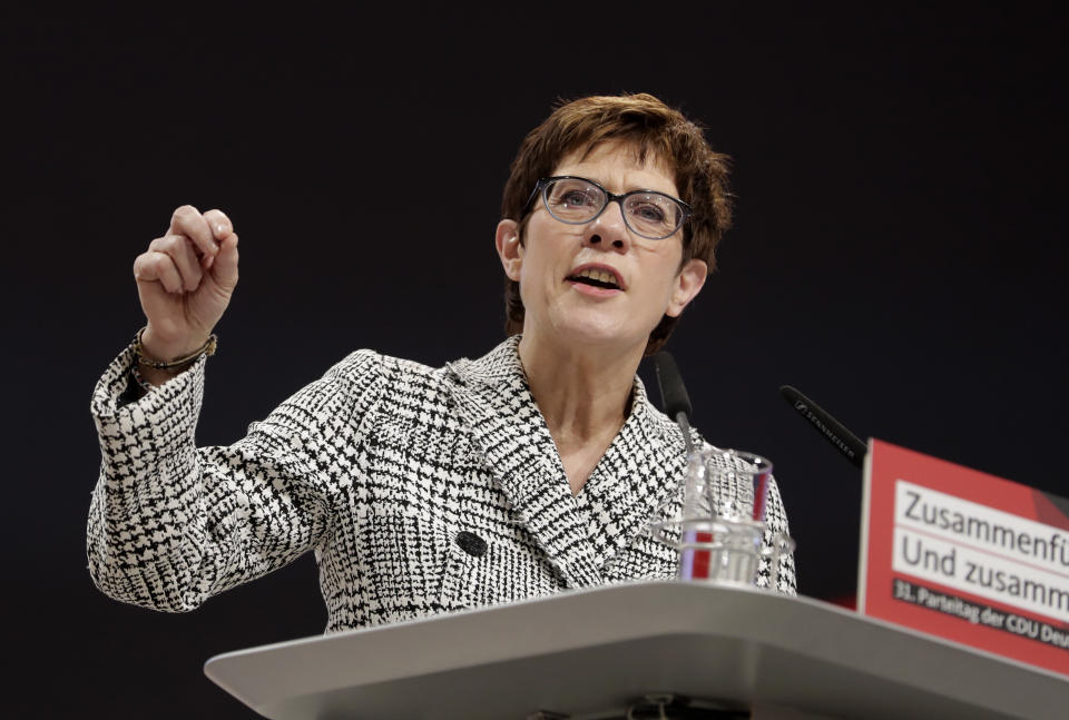 CDU General Secretary Annegret Kramp-Karrenbauer delivers her speech when running as chairwoman at the party convention of the Christian Democratic Party CDU in Hamburg, Germany, Friday, Dec. 7, 2018. 1001 delegates are electing a successor of German Chancellor Angela Merkel who doesn't run again for party chairmanship after more than 18 years at the helm of the party. (AP Photo/Michael Sohn)