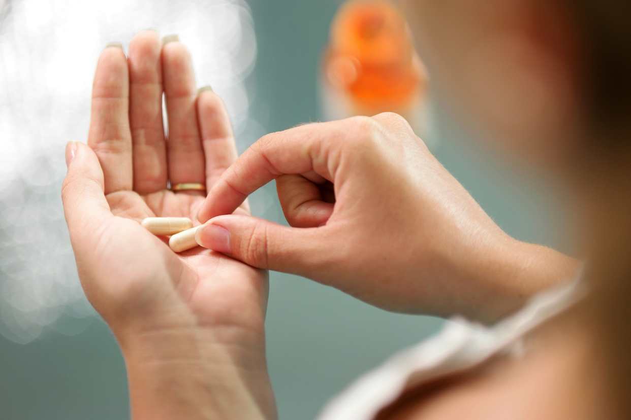 Woman taking pills