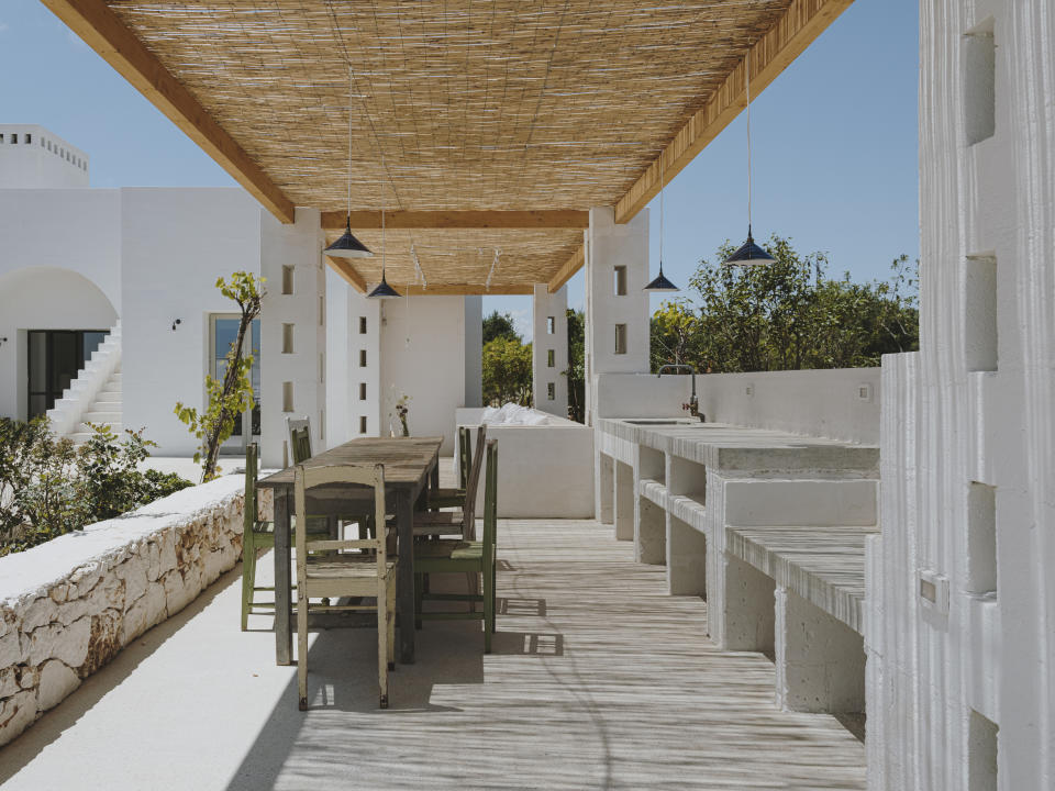 An outdoor area with a roof above the deck