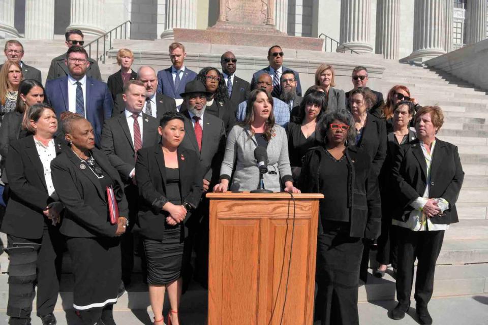 Missouri House Minority Leader Crystal Quade, a Springfield Democrat, center, and fellow House Democrats push for legislation that would allow local governments to enact stricter gun regulations following the mass shooting at the Kansas City Chiefs Super Bowl victory rally.