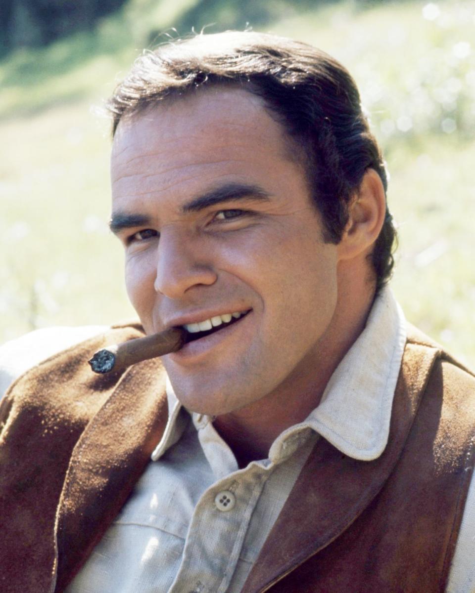<p>Here he is getting into character on the set of <em>Sam Whiskey </em>in 1969 by smoking a cigar. </p>