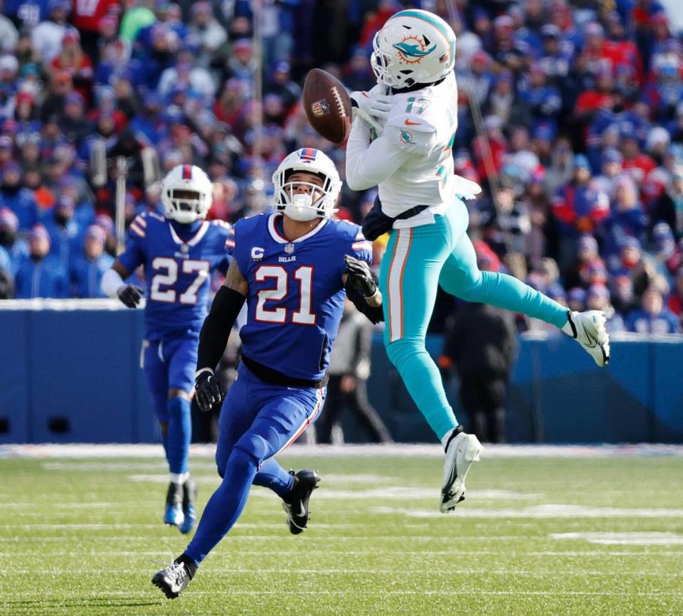 Miami Dolphins wide receiver Jaylen Waddle (17) can’t hold onto the ball as Buffalo Bills safety Jordan Poyer (21) defends in the first quarter during the NFL wild-card football game at Highmark Stadium, Orchard Park, NY, on Sunday, January 15, 2023.