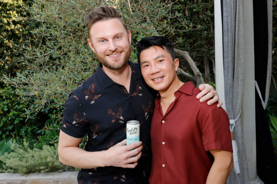 Bobby Berk and Dewey Do posing for a photo at an Owl's Brew event