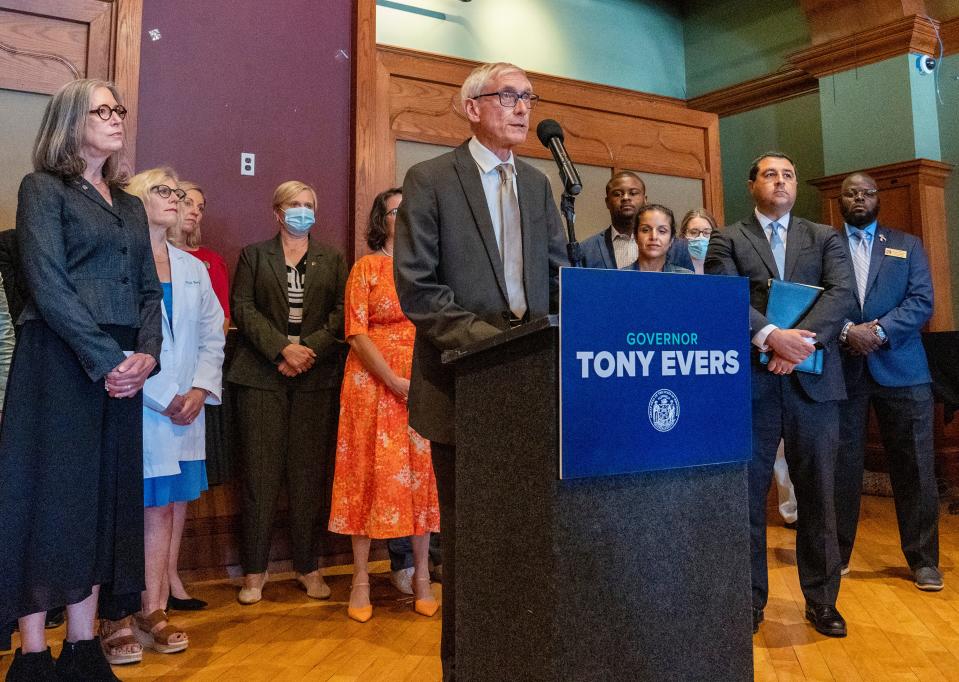 Gov. Tony Evers and Attorney General Josh Kaul host a news conference relating to the U.S. Supreme Court decision in Dobbs on Tuesday at Milwaukee Turner Hall in Milwaukee.
