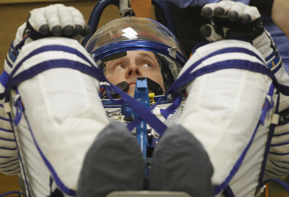 U.S. astronaut Nick Hague, member of the main crew of the expedition to the International Space Station (ISS), looks on during inspecting his space suit prior the launch of Soyuz MS-12 space ship at the Russian leased Baikonur cosmodrome, Kazakhstan, Thursday, March 14, 2019. (AP Photo/Dmitri Lovetsky)