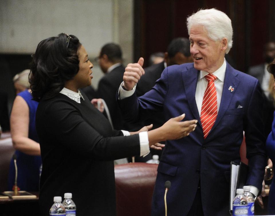 Lovely A. Warren, Mayor of Rochester, left, talks with former President Bill Clinton before members of the New York state's Electoral College vote for president in the Senate Chamber of the Capitol in Albany, N.Y., Monday, Dec. 19, 2016. New York's 29 members of the Electoral College cast their ballots for Hillary Clinton, who won the state despite losing the presidential race to Republican Donald Trump. (AP Photo/Hans Pennink, Pool)