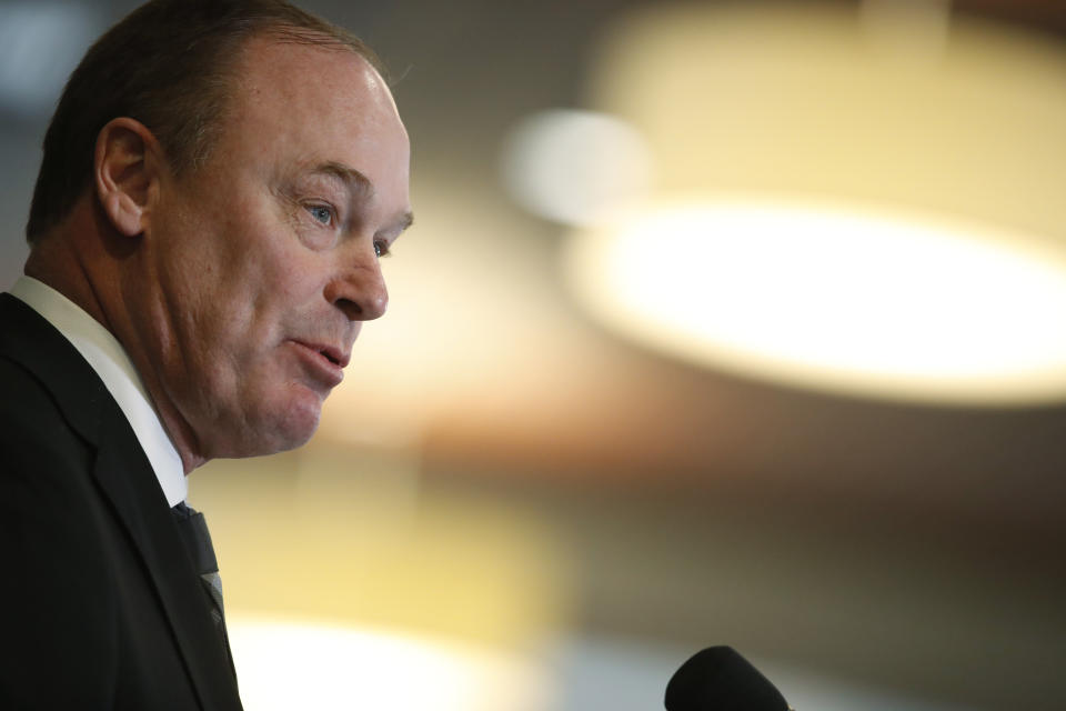 Colorado athletic director Rick George announces that Karl Dorrell is the new NCAA college head football coach at Colorado during a news conference Monday, Feb. 24, 2020, in Boulder, Colo. (AP Photo/David Zalubowski)