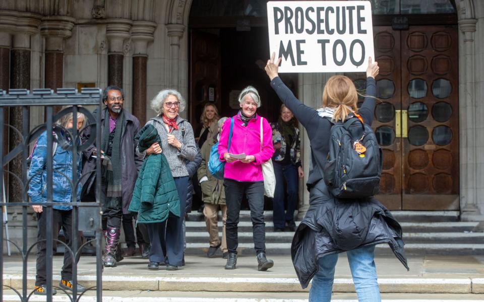 Trudi Warner and campaigners outside the Royal Courts of Justice in London