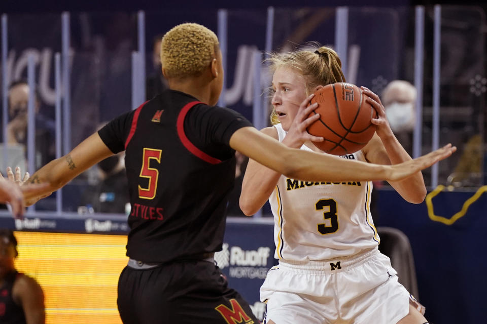 Michigan guard Maddie Nolan (3) looks to pass as Maryland forward Alaysia Styles (5) defends during the first half of an NCAA college basketball game, Thursday, March 4, 2021, in Ann Arbor, Mich. (AP Photo/Carlos Osorio)