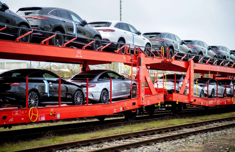 New cars are loaded onto multiple wagons at the Automotive Logistics Center Bremen on the DB Cargo site. Sales of new cars in Germany fell sharply in August compared to the same month last year, largely due to weak demand for electric vehicles, figures from the Federal Motor Transport Authority (KBA) showed on Wednesday. Hauke-Christian Dittrich/dpa