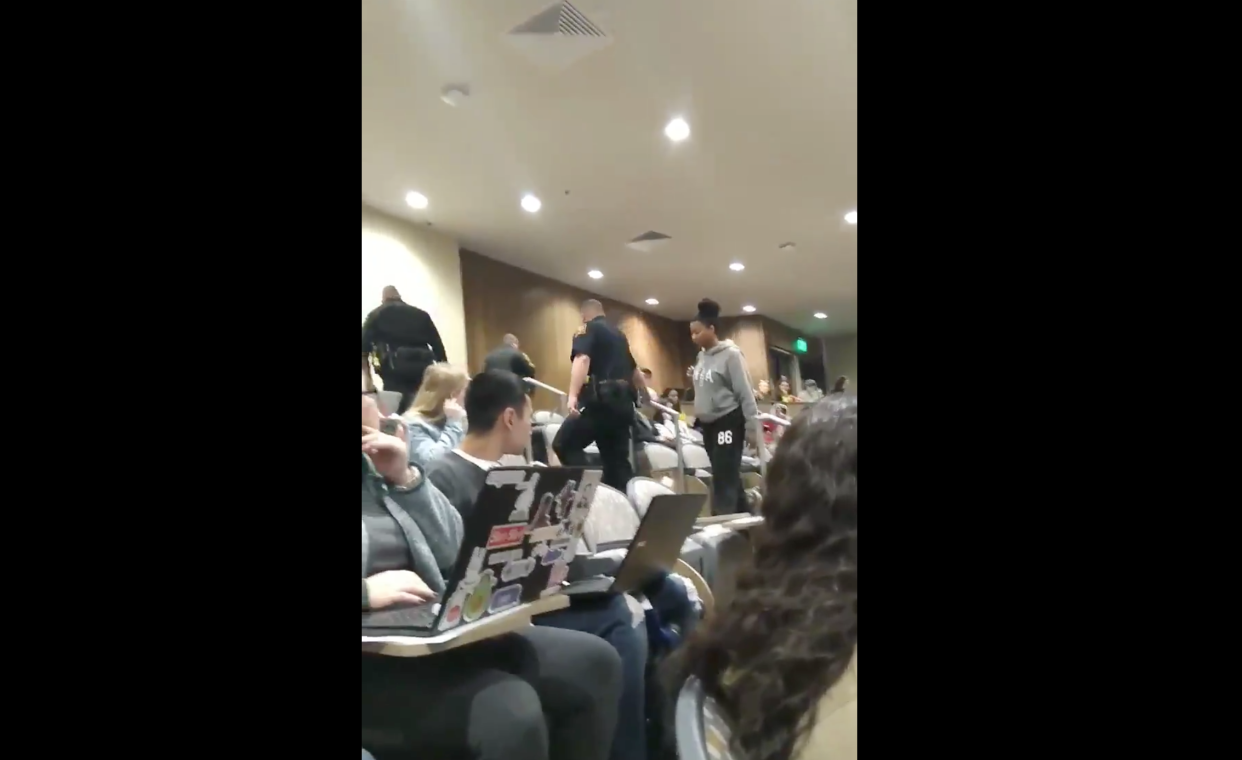 A college student at the University of Texas at San Antonio was escorted from a biology class for reportedly putting her feet up on a chair, in a viral video. (Photo: Twitter/Apurva Rawal)