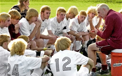 Algonquin coach John Frederick, right, gives a halftime talk to his boy's varsity soccer team members, during game against Wachusett in 2006.