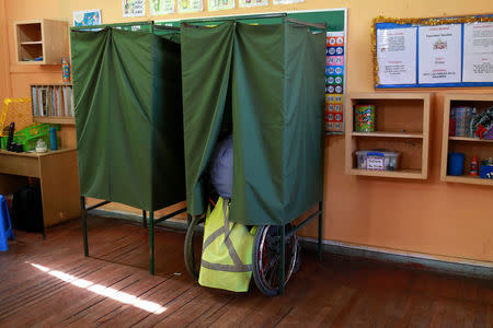 A citizen votes at a polling station during the presidential election, in Santiago, Chile December 17, 2017. REUTERS/Pablo Sanhueza