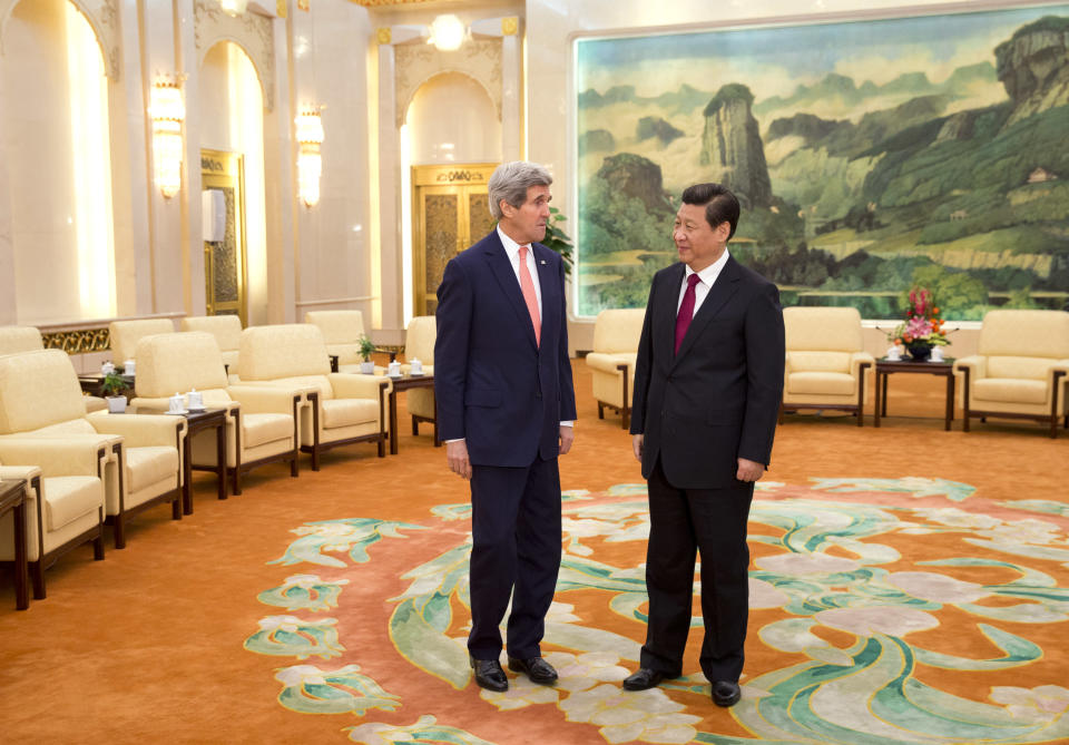 U.S. Secretary of State John Kerry, left, meets with Chinese President Xi Jinping at the Great Hall of the People in Beijing, China Friday, Feb. 14, 2014. Kerry is meeting senior Chinese officials on Friday in Beijing to seek their help in bringing a belligerent North Korea back to nuclear disarmament talks. (AP Photo/Evan Vucci, Pool)