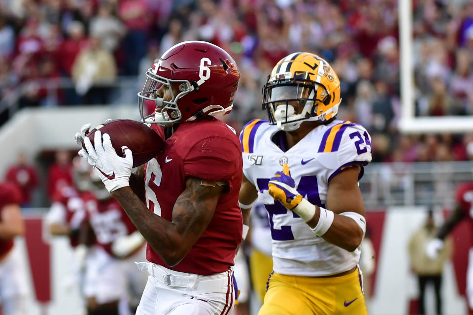 Alabama wide receiver DeVonta Smith (6) makes a catch for a touchdown as LSU cornerback Derek Stingley Jr. (24) defends in the first half of an NCAA college football game, Saturday, Nov. 9, 2019, in Tuscaloosa , Ala. (AP Photo/Vasha Hunt)