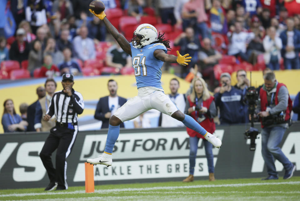 <p>Los Angeles Chargers wide receiver Mike Williams (81) celebrates after scoring a touchdown during the second half of an NFL football game against Tennessee Titans at Wembley stadium in London, Sunday, Oct. 21, 2018. (AP Photo/Tim Ireland) </p>