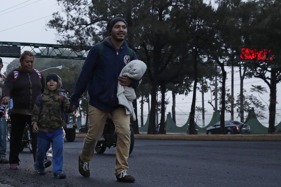 Honduran migrants resume they journey in hopes of reaching the United States after sleeping in Guatemala City, Saturday, Jan. 18, 2020. Guatemalan officials had counted more than 3,000 migrants who registered at border crossings to enter the country in recent days and there were additional migrants who did not register. (AP Photo/Moises Castillo)