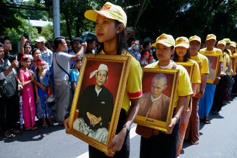 People hold portraits of independence leaders to mark the 72nd anniversary of Martyrs' Day in Yangon