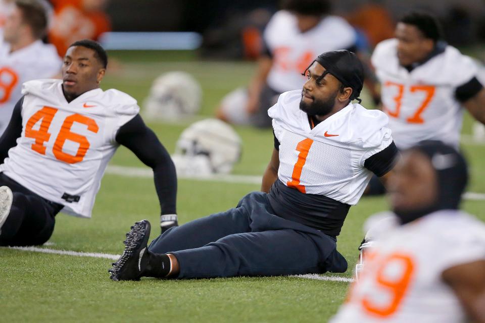 Xavier Benson, right, had 120 tackles at Tyler Junior College before transferring to Oklahoma State in the offseason.