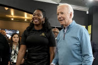 Chynna Phillips, left, owner of the Regal Lounge barber shop and spa, greets President Joe Biden in Columbia, S.C. Saturday Jan. 27, 2024. (AP Photo/Jacquelyn Martin)