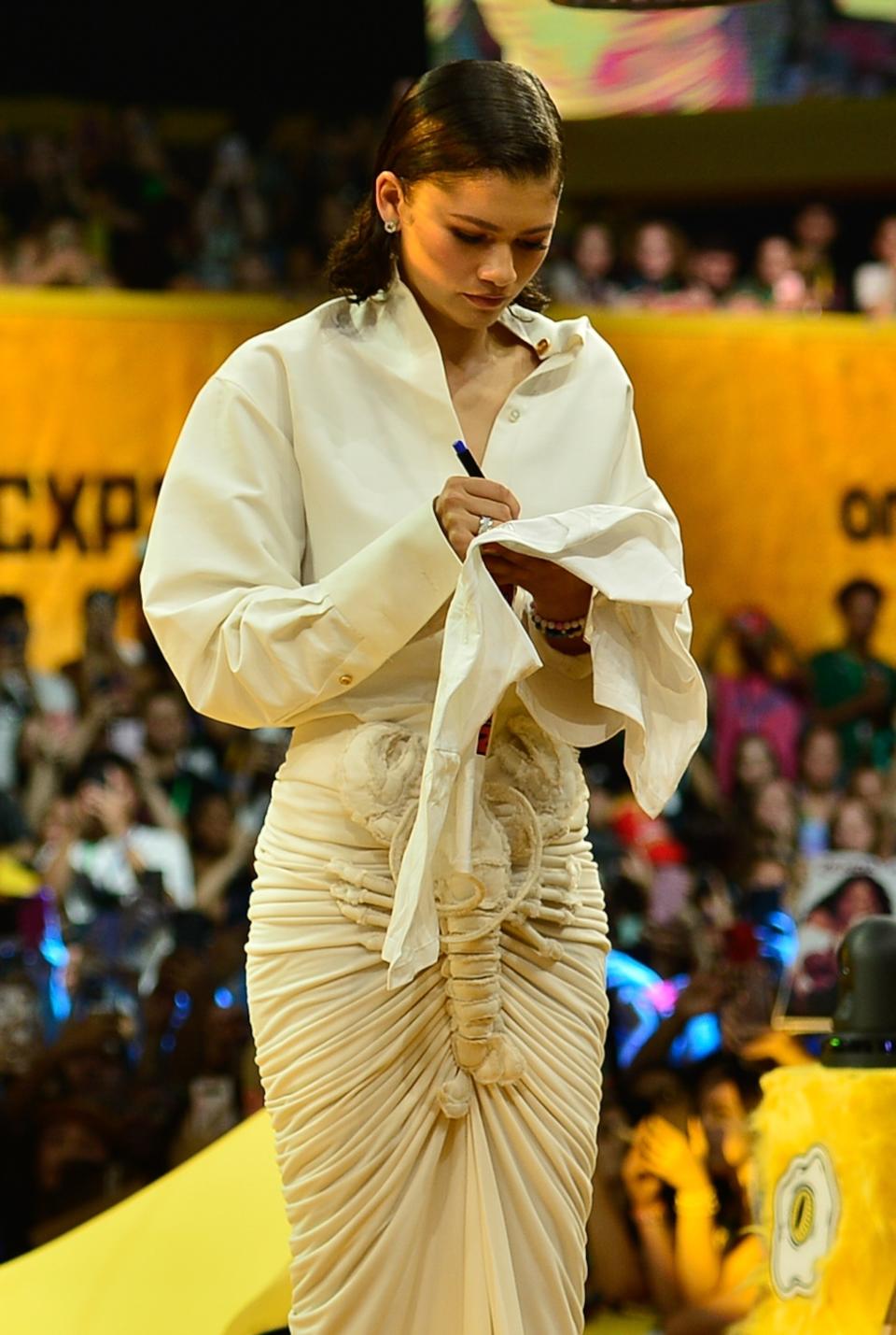 Zendaya in a Schiaparelli white Lobster Skirt and button-down