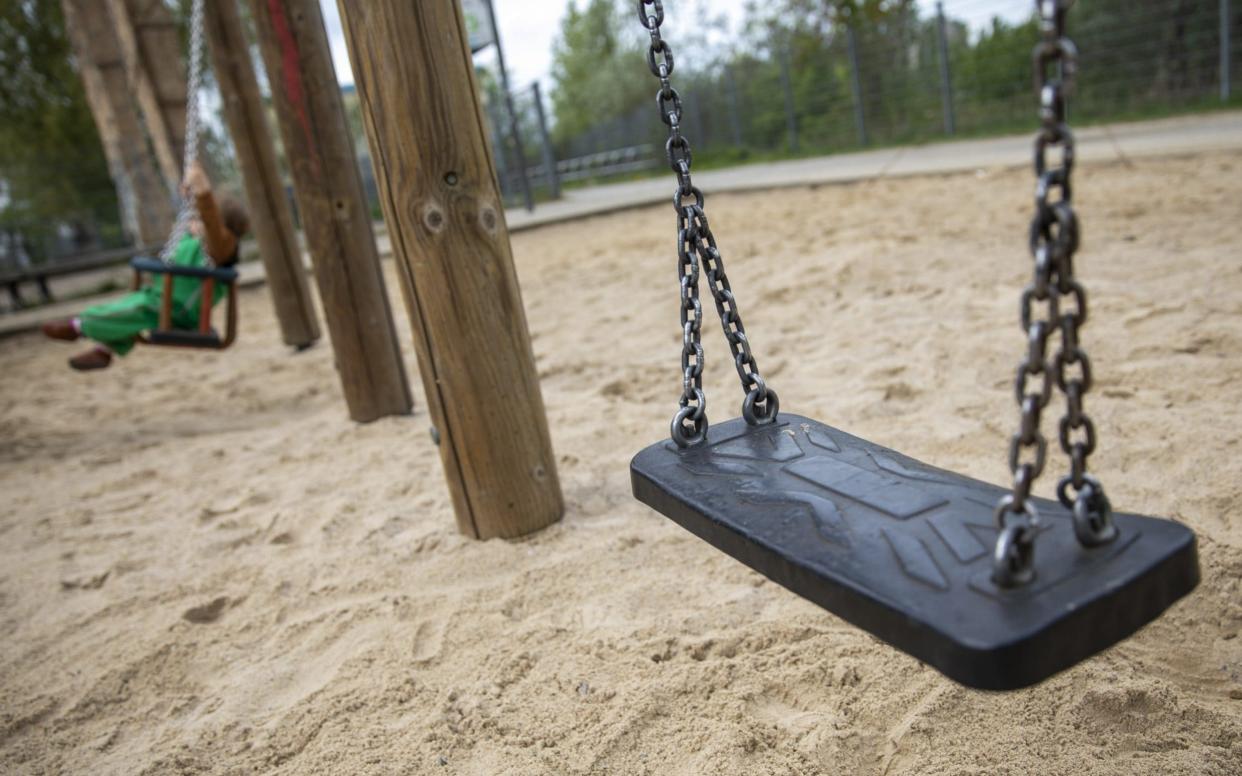 BERLIN, GERMANY - APRIL 30: A child plays on a public playground on the first day that many playgrounds are opening again during the novel coronavirus (Covid-19) crisis on April 30, 2020 in Berlin, Germany. Germany is taking its first steps to ease restrictions on public life that had been imposed weeks ago in order to stem the spread of the coronavirus. Shops across the country are reopening, factory assembly lines are restarting and high schools are holding final exams. Health leaders are monitoring the process carefully for any resurgence of coronavirus infections. (Photo by Maja Hitij/Getty Images) - Maja Hitij/Getty Images Europe