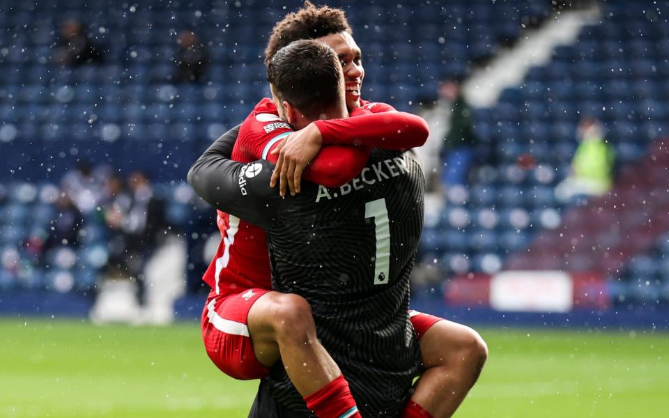 Trent Alexander-Arnold celebrates with Alisson - MARC ASPLAND