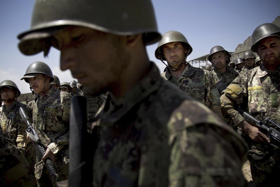 FILE - Afghan Army soldiers gather at a training facility on the outskirts of Kabul, Afghanistan, Wednesday, May 8, 2013. (AP Photo/Anja Niedringhaus, File)