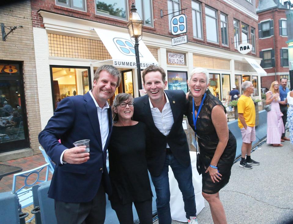 City Councilor Rich Blalock, left, Betsy Brown Scott, Mayor Deaglan McEachern and Portsmouth 400th anniversary celebration organizer Denise Wheeler enjoy the festivities during a lobster dinner for 900 people Wednesday, Aug. 16, 2023, on Congress Street.