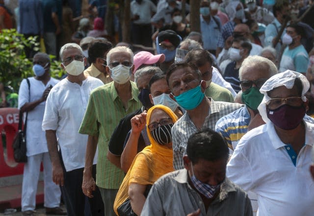 People queue for a Covid-19 vaccine in Mumbai, India 