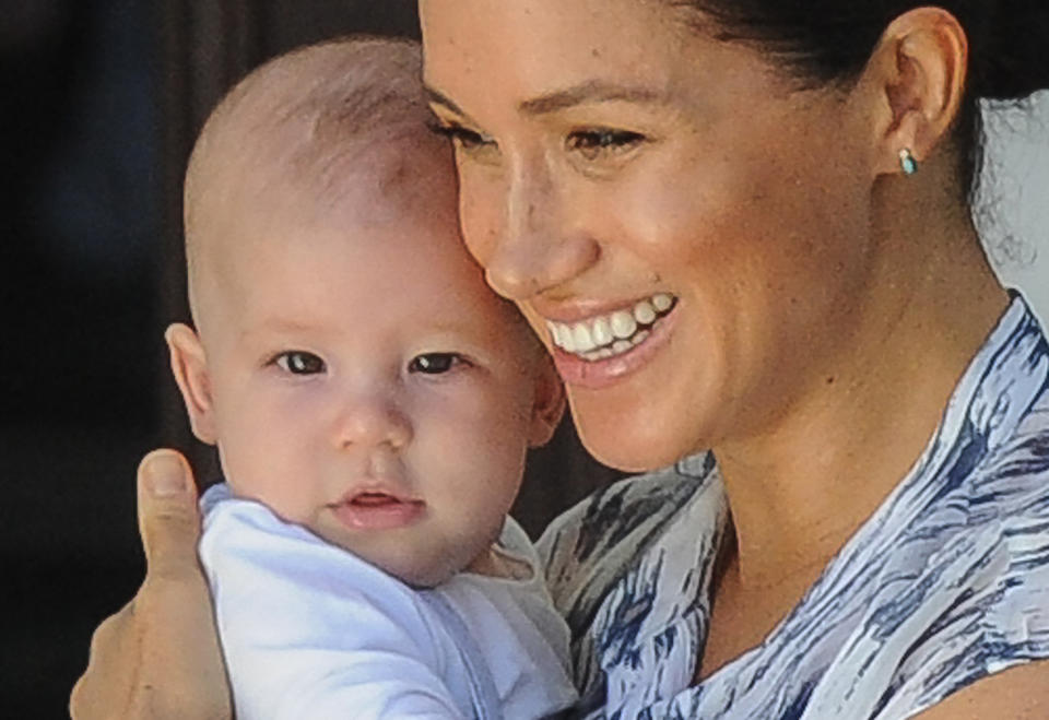 Meghan, Duchess of Sussex holds her baby son Archie as she and Britain's Prince Harry, Duke of Sussex meet Archbishop Desmond Tutu and his wife Leah at the Tutu foundation in Cape Town on September 25, 2019. (Photo by HENK KRUGER / POOL / AFP)        (Photo credit should read HENK KRUGER/AFP/Getty Images)