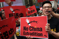 Demonstrators march during a protest to demand authorities scrap a proposed extradition bill with China, in Hong Kong, China April 28, 2019. REUTERS/Tyrone Siu