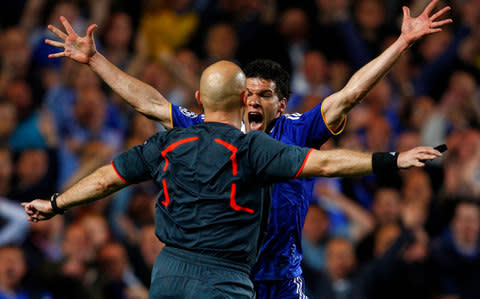 Ballack gesticulates in front of Ovrebo - Credit: Reuters