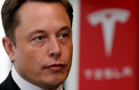 Tesla Motors Inc Chief Executive Elon Musk pauses during a news conference in Tokyo September 8, 2014. REUTERS/Toru Hanai/Files