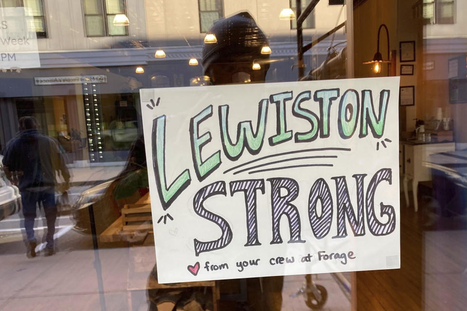 FILE - A cafe shows its support for the community following a mass shooting, Saturday, Oct. 28, 2023, in Lewiston, Maine. Despite warnings of deteriorating mental health, drunken threats and guns, the sheriff department chose to avoid confronting an Army reservist who later killed 18 people and work with family and the Army to get him help, states the report, released late Thursday, Dec. 14, 2023. (AP Photo/Jake Bleiberg, File)