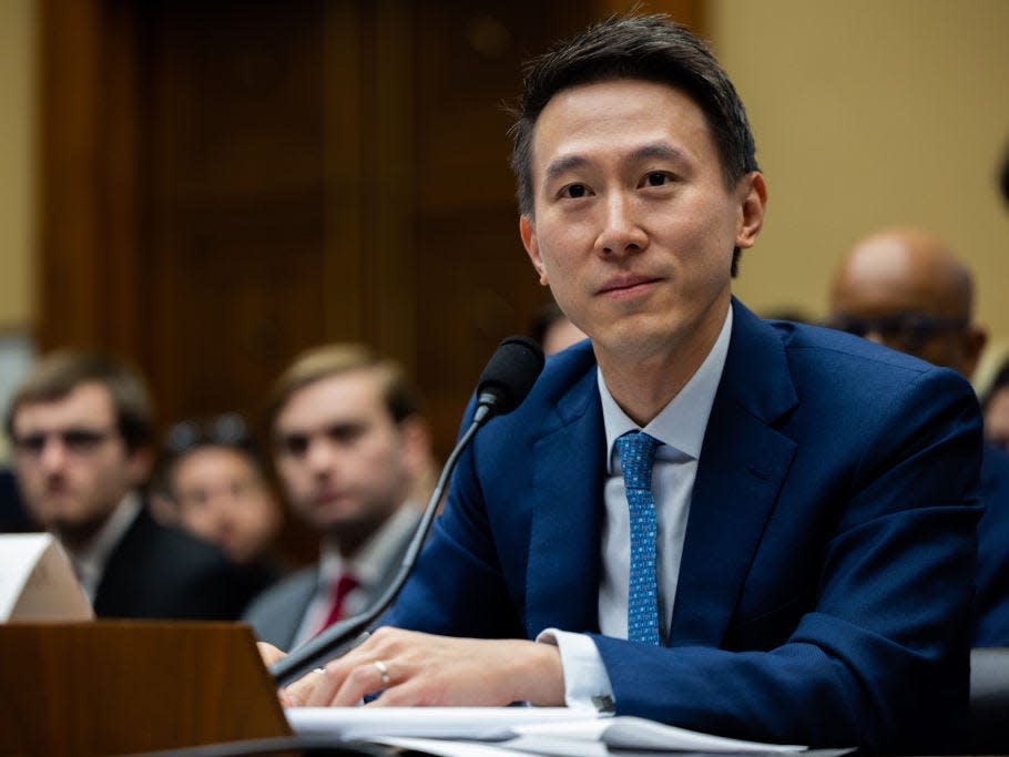 TikTok CEO Shou Zi Chew listens to questions from U.S. representatives during his testimony at a Congressional hearing