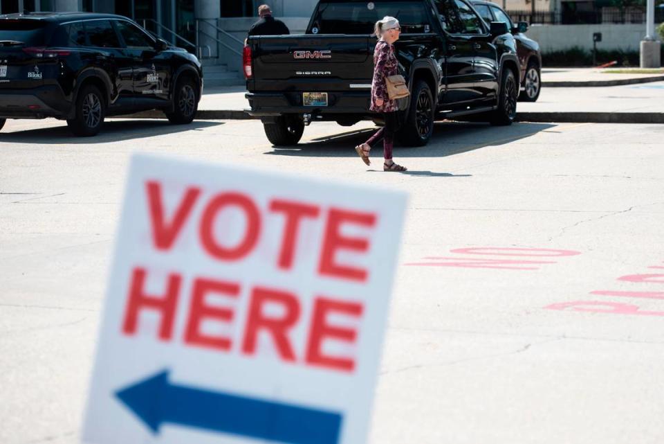 Voters enter leave the Lopez Quave Public Safety Center in Biloxi after voting in a primary election runoff on Tuesday, Aug. 29, 2023.