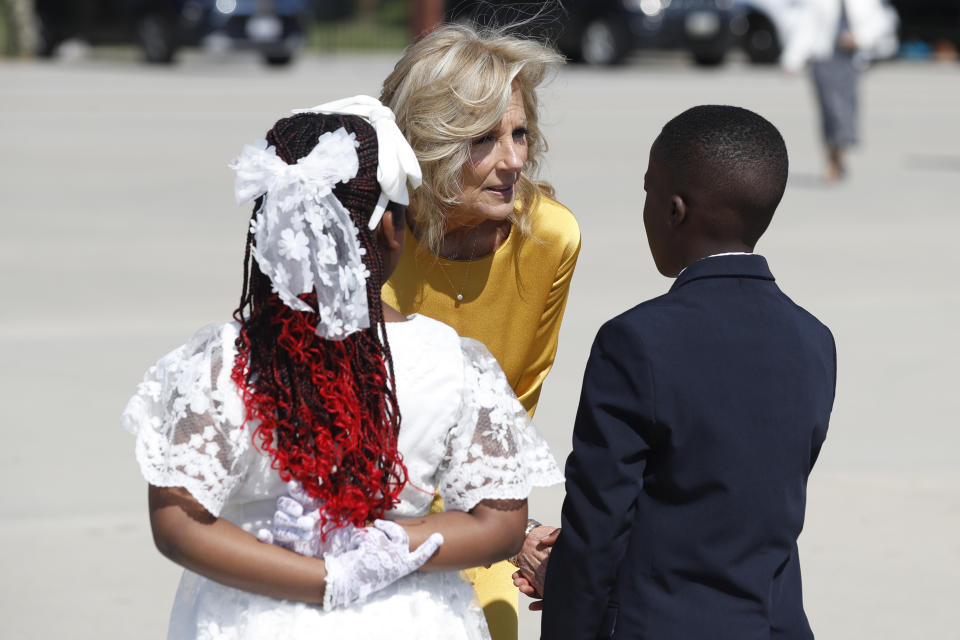 First lady Jill Biden, center, talks to flower presenters after Kenya's President William Ruto and first lady Rachel Ruto, arrived at Andrews Air Force Base, Md., Wednesday, May 22, 2024, for a state visit to the United States. (AP Photo/Luis M. Alvarez)