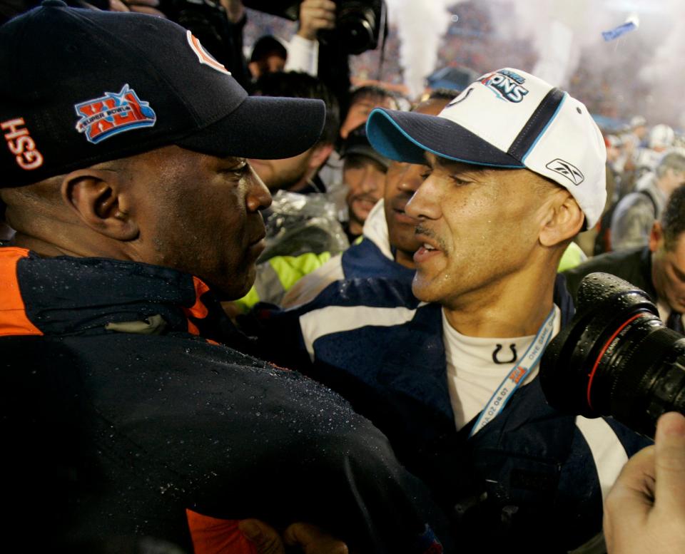 Indianapolis Colts head coach Tony Dungy (right) hugs Chicago Bears head coach Lovie Smith at the end of the Super Bowl 41 football game at Dolphin Stadium in Miami on Feb. 4, 2007.