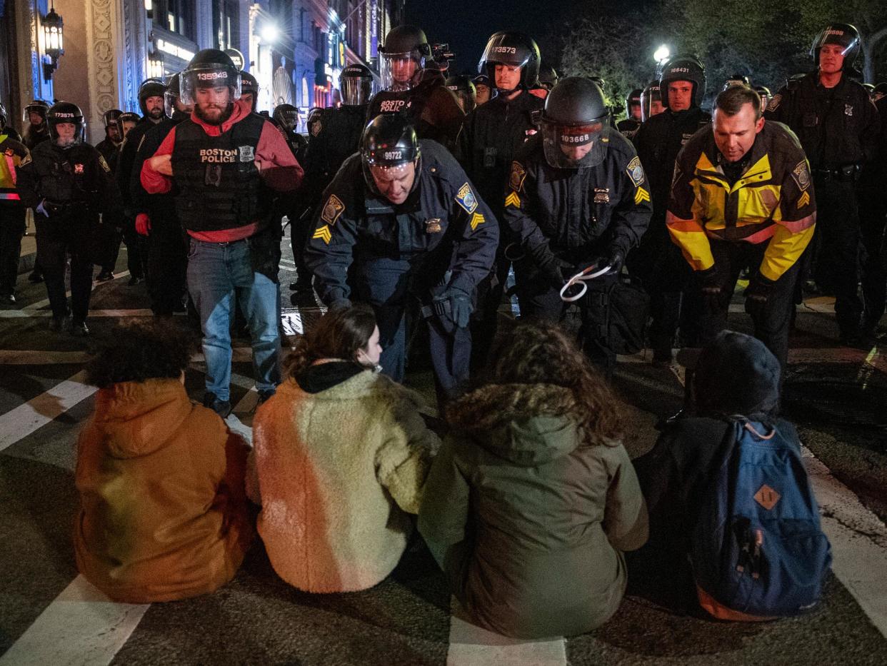 <span>Police move in to arrest pro-Palestinian supporters at Emerson College in Boston on Thursday.</span><span>Photograph: Joseph Prezioso/AFP/Getty Images</span>