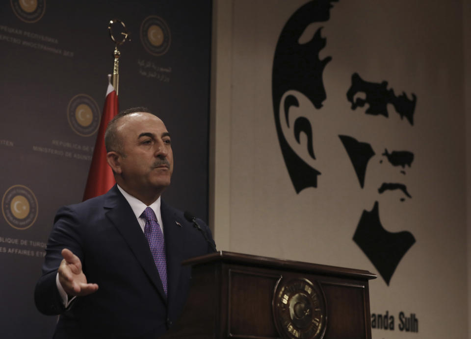 Turkey's Foreign Minister Mevlut Cavugoglu speaks during a news conference in Ankara, Turkey, Wednesday, July 24, 2019. Cavusoglu says a new U.S. proposal concerning the creation of a possible "safe zone" in northern Syria was not "satisfactory".(AP Photo/Burhan Ozbilici)