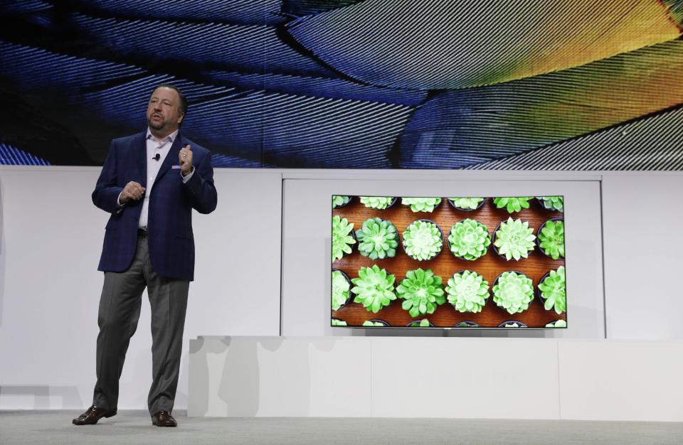 Joe Stinziano, executive vice president of Samsung Electronics America, introduces the Samsung QLED TV with Quantum dot Technology during a Samsung news conference before CES International, Wednesday, Jan. 4, 2017, in Las Vegas. (AP Photo/John Locher)