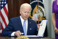 President Joe Biden signs into law S. 2938, the Bipartisan Safer Communities Act gun safety bill, in the Roosevelt Room of the White House in Washington, Saturday, June 25, 2022. (AP Photo/Pablo Martinez Monsivais)